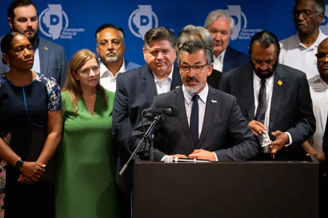 Texas Democrats hold a news conference in Illinois after fleeing their home state