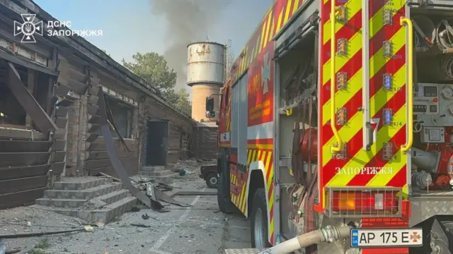 A handout picture from the State Emergency Service of Ukraine shows firefighters at the scene of the attack