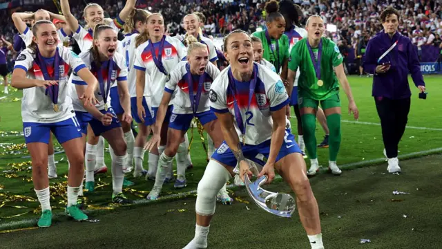 Lucy Bronze of England celebrates with the UEFA Women's EURO trophy