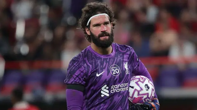 Alisson Becker in action for Liverpool