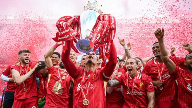 Virgil van Dijk of Liverpool lifts the trophy after the Premier League match between Liverpool FC and Crystal Palace
