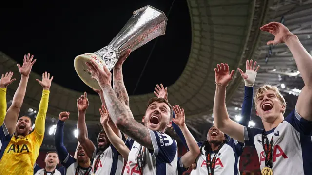 James Maddison lifts the Europa League trophy
