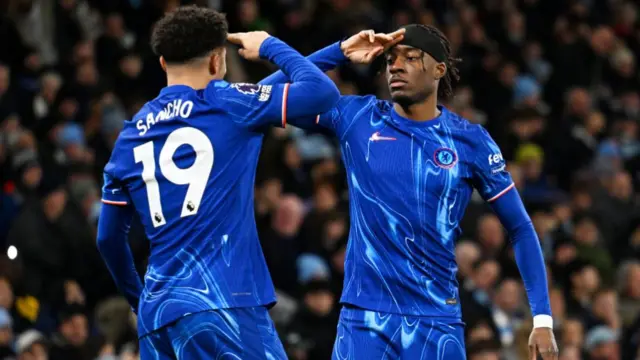 Noni Madueke of Chelsea celebrates scoring his team's first goal with teammate Jadon Sancho