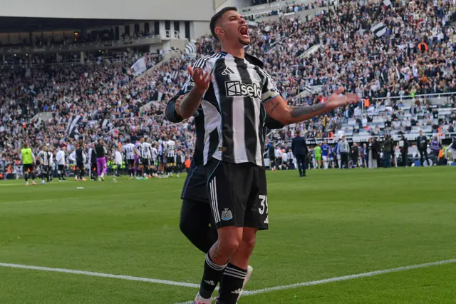 Bruno Guimaraes celebrating in a Newcastle kit