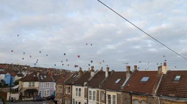 Balloons flying over the Bristol skyline