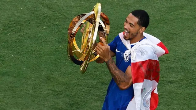Levi Colwill of Chelsea FC lifts the FIFA Club World Cup trophy