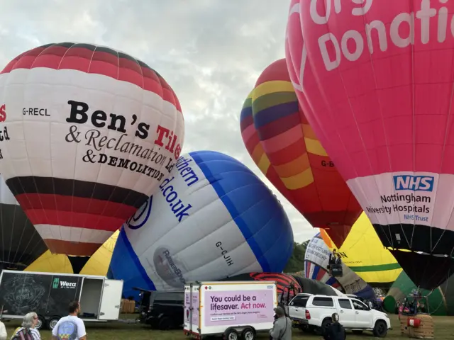 Several inflated balloon waiting for take off