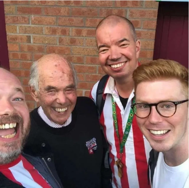 Phil with three generations of family