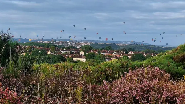 Lots of hot air balloons in the sky