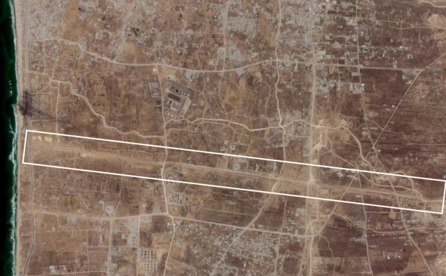 A satellite image showing the Netzarim Corridor. A box is imposed over the image to highlight the route, which runs east to west across Gaza.