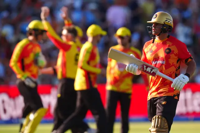 Birmingham Phoenix's Will Smeed (right) walks off the field after being caught out by Trent Rockets' Sam Cook during the Hundred Men's match at Edgbaston, Birmingham