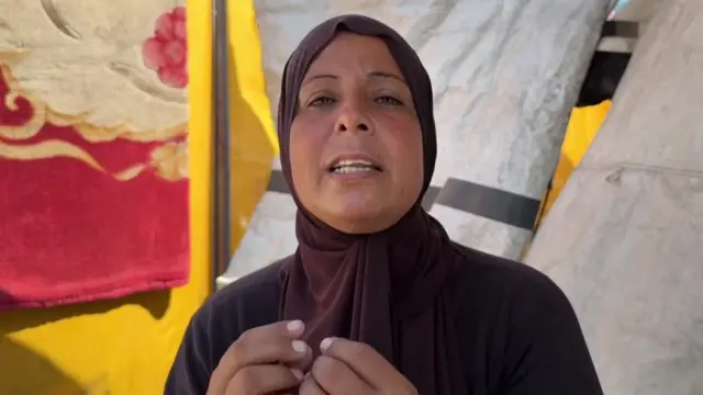 Sabrin Naaim speaks from inside a Gaza City tent