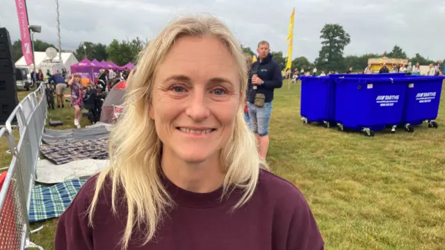 Jo Vickers smiles at the camera. She has shoulder length blonde hair and a burgunday jumper.