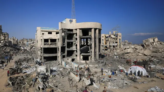 A view of the site surrounding an evacuated UNRWA clinic where displaced people were taking shelter, following an overnight Israeli strike, in Gaza City August 6, 2025