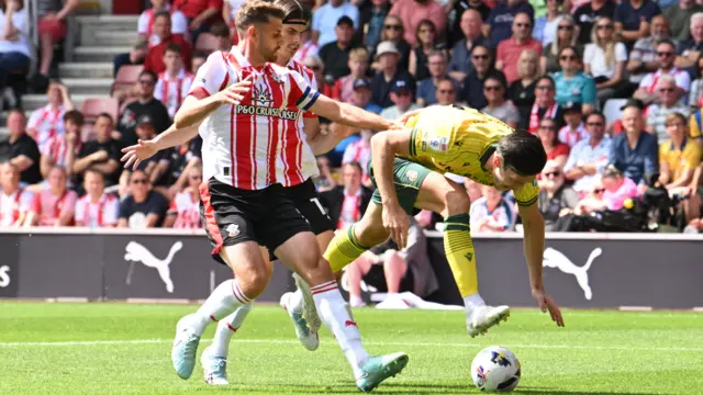 Kieffer Moore (19) of Wrexham is fouled