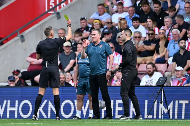 Phil Parkinson, Manager of Wrexham is shown a yellow card during the Sky Bet Championship match between Southampton and Wrexham AFC at St Mary's Stadium on August 09, 2025 in Southampton, England. (Photo by Dan Mullan/Getty Images)