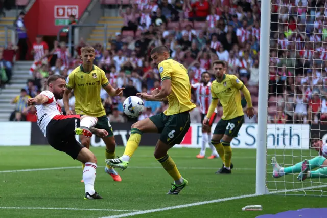 Southampton's Adam Armstrong (left) attempts a shot towards goal but is blocked by Wrexham's Conor Coady