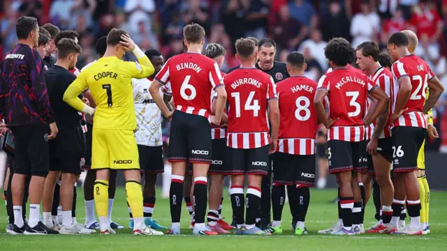 Ruben Selles speaks to his side on the pitch