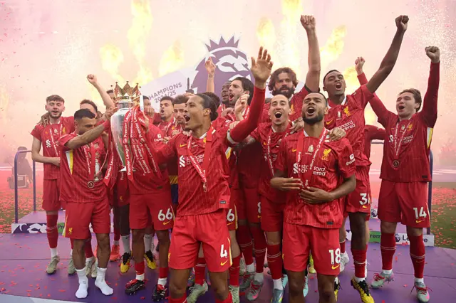 Liverpool celebrating with Premier League trophy