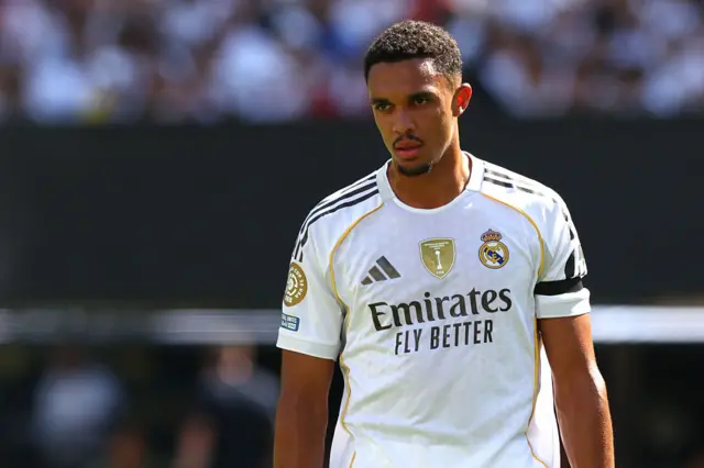 Trent Alexander-Arnold looking on in a Real Madrid kit