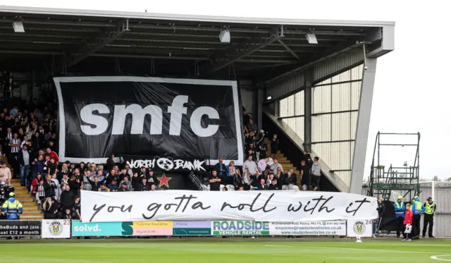 St Mirren fans produce an Oasis style display which reads 'SMFC, you gotta roll with it'