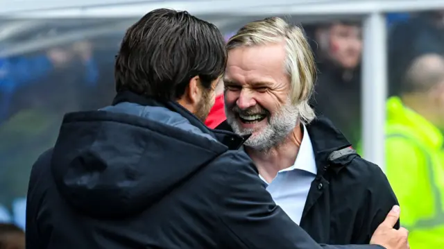 Russell Martin and Steven Pressley embrace