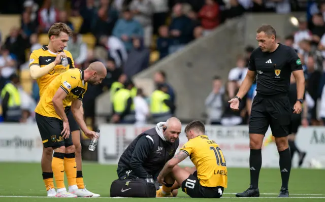 Livingston's Graham Carey goes down injured