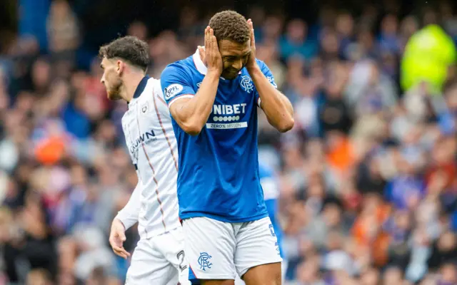 Cyriel Dessers cuts a frustrated figure