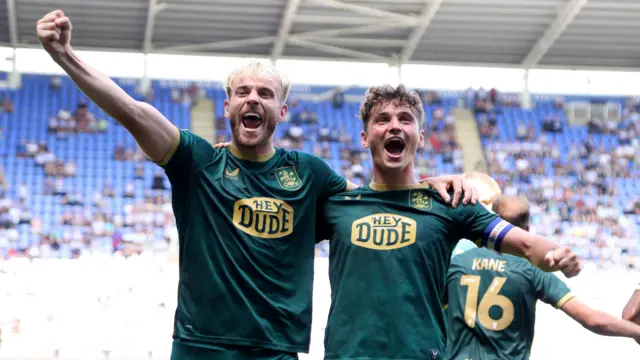 Huddersfield players celebrate a goal
