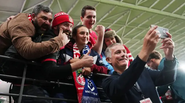 Wrexham manager Phil Parkinson takes a selfie with fans