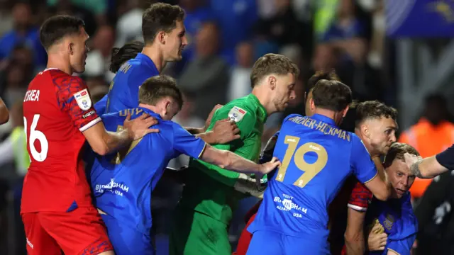 A melee between players after Ipswich's late equaliser at Birmingham