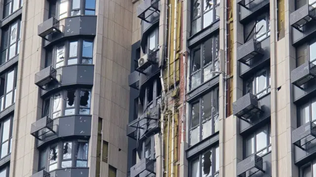 The exterior of a building hit by drone strike