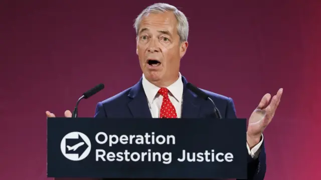 Nigel Farage giving a speech. In front of him is a lecturn with the slogan "Operation Restoring Justice" and a logo which has a black arrow pointing to the right and the outline of a white plane inside it.