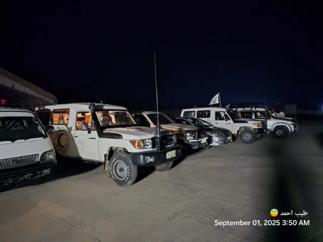 Six vehicles in line in the night
