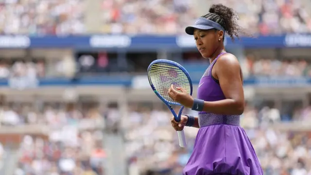 naomi osaka looks on during a match at the us open
