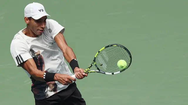 Felix Auger-Aliassime returns to Rublev