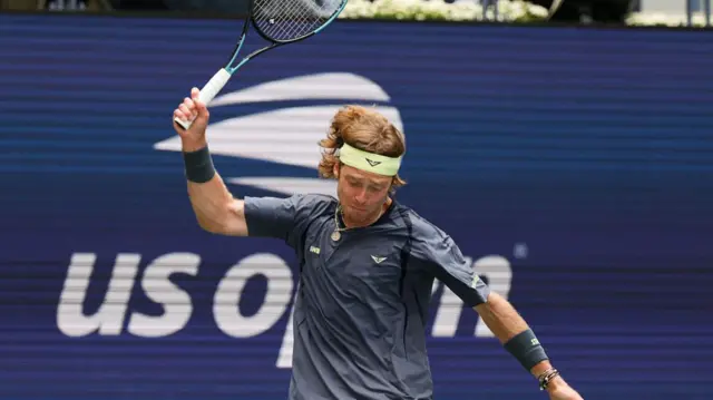 Andrey Rublev throws his racquet down in anger.