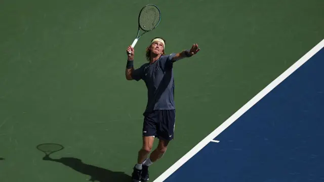 Andrey Rublev serves vs Felix Auger-Aliassime