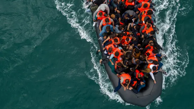 An aerial view of a small boat crossing the English Channel