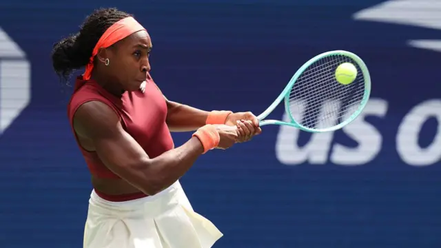 Coco Gauff returns with a backhand vs Naomi Osaka