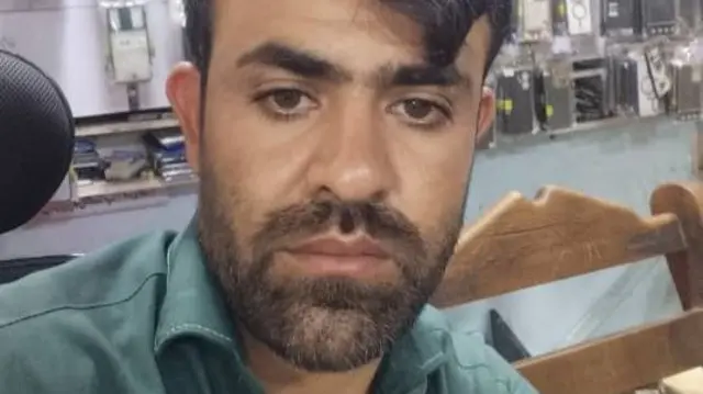 A selfie of an Afghan man taken in a phone shop.