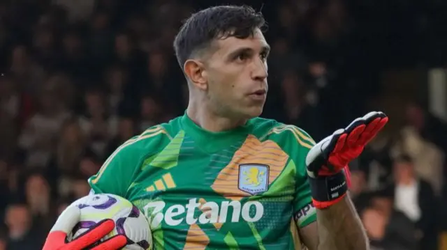 Martinez blows a kiss to the Fulham fans after saving a penalty