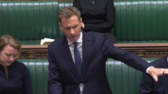 Man in suit addressing Commons
