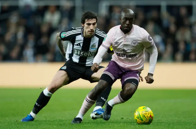 Yoane Wissa battles for the ball with Sandro Tonali during Brentford's game against Newcastle United last season