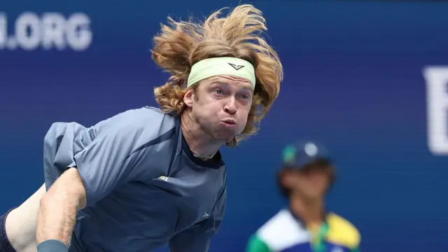 Andrey Rublev serves vs Felix Auger-Aliassime