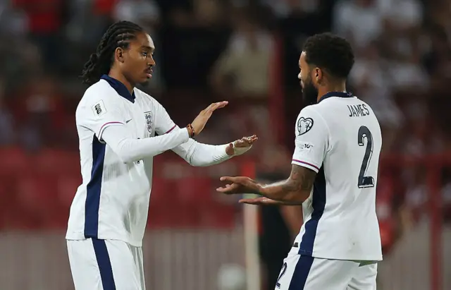 Djed Spence taps hands with Reece James