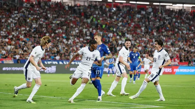 Noni Madueke celebrates with England team-mates