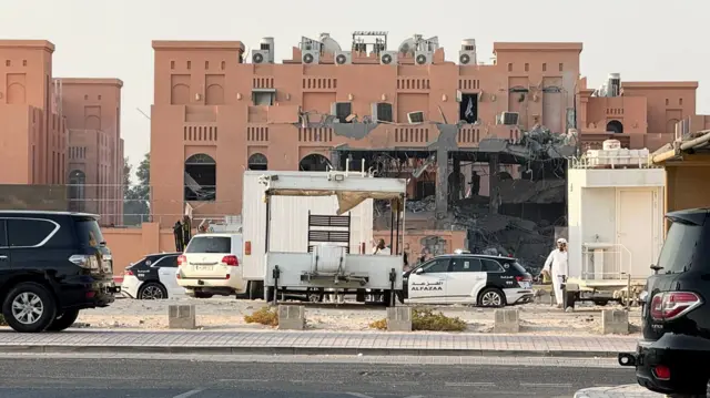 Building with demolished and burned out section at the front