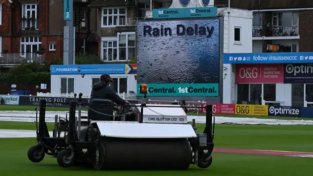 A roller on the outfield during a rain delay