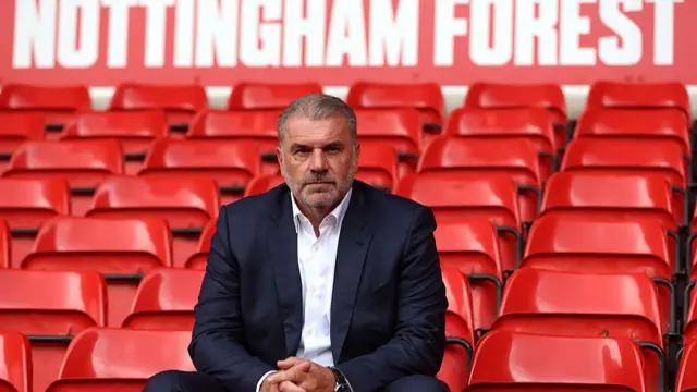 Ange Postecoglou poses for a photo i